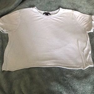 Light blue cropped t-shirt.